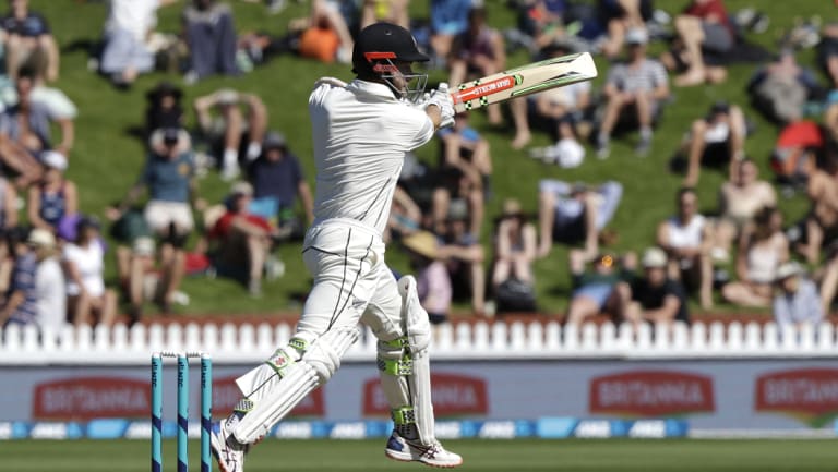 Aggressive: Kane Williamson strikes a boundary in Wellington.
