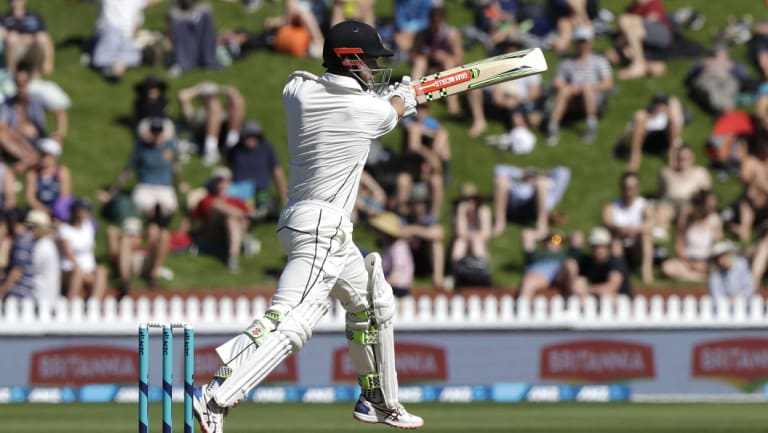 Aggressive: Kane Williamson strikes a boundary in Wellington.