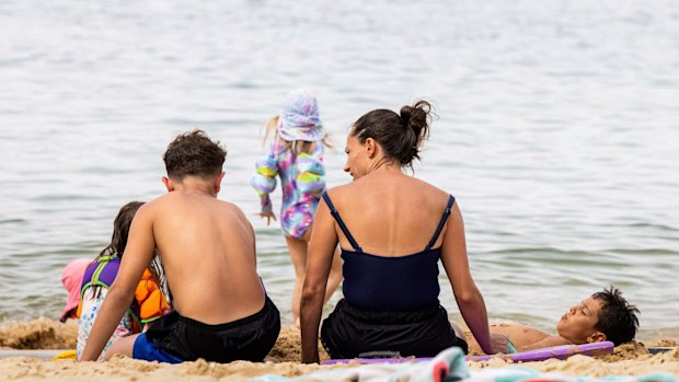 Flat and fancy: Families enjoy Balmoral Beach.