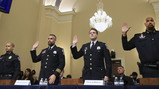 US Capitol Police Sergeant Aquilino Gonell, from left, officer Michael Fanone, officer Daniel Hodges and U.S. Capitol Police Sergeant Harry Dunn are sworn in. 