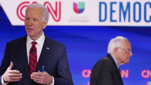 Former vice-president Joe Biden and Bernie Sanders at the debate in Washington.