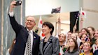Albanese and Takaichi take a selfie with school children in Parliament House on Monday.