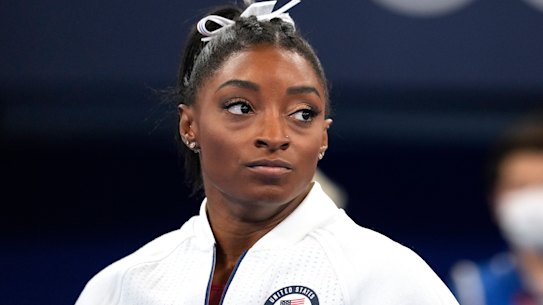 Simone Biles watches on after her shock exit from the team final.