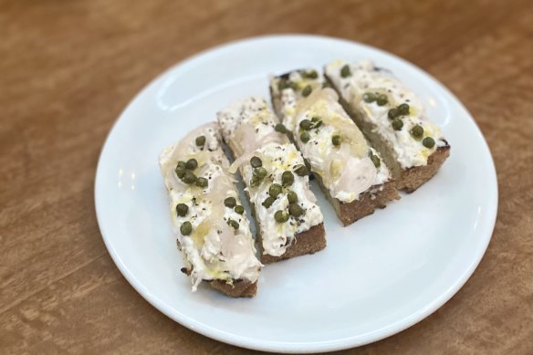 Tuna bruschetta with capers, shallots and lemon.