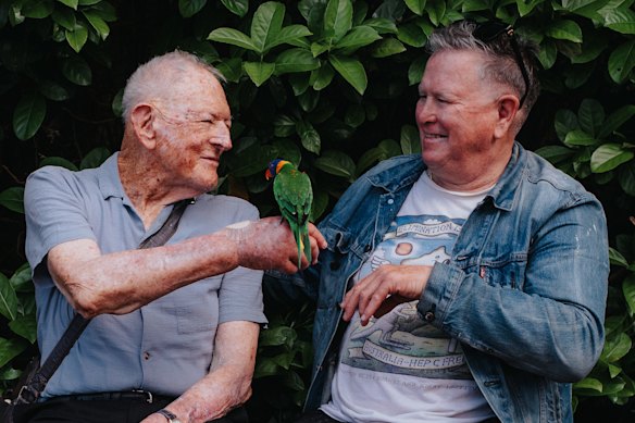 Tom Mehigan, left,  with Jethro Brookes  and lorikeet Rosie.