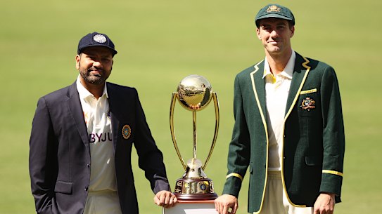 Opposing captains Rohit Sharma of India and Pat Cummins with the Border–Gavaskar Trophy in February. They meet again in the World Test Championship final, beginning on Wednesday.