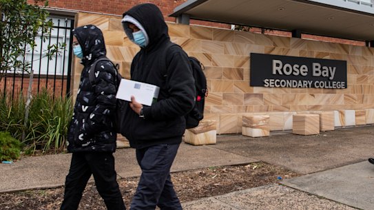 Cleaners arrive at Rose Bay Secondary College in Dover Heights on Tuesday after a student tested positive to COVID-19.