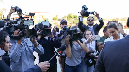 Journalists wait to speak to detectives outside the Carnarvon Couthouse in regional WA.