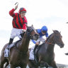 Tim Clark stands in the irons after Converge holds off Anamoe in the Randwick Guineas.