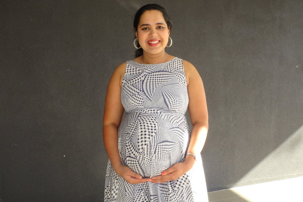 Ashwitha D'Souza standing outside her apartment building the day before she gave birth. 