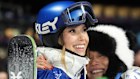 China’s Eileen Gu, left, gets a hug from her mother Yan Gu as she competes in the women’s freestyle skiing big air qualifications.