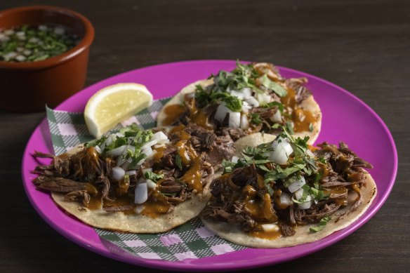 Lamb barbacoa tacos come with chilli-spiked consommé for dipping.