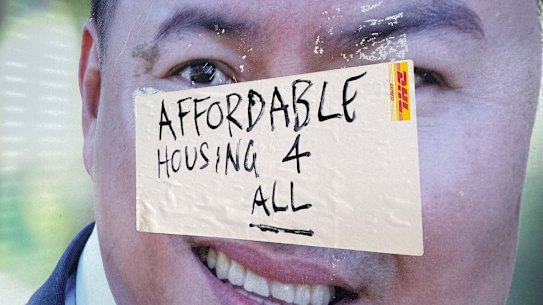 A sticker on a Brisbane real estate agent’s sign delivers a silent protest over the cost of housing.