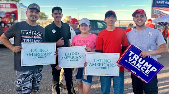 Jesus Poblete, left, and members of his family after a J. D. Vance rally outside Tucson, Arizona on October 22.