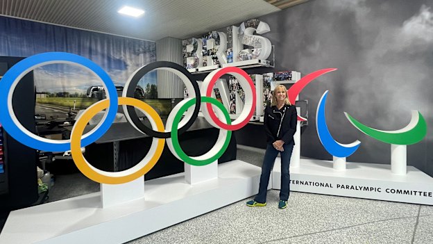 Brisbane 2032 chief executive Cindy Hook, shown with the Olympic rings and agitos, is one of many stakeholders eagerly waiting a final plan for the Games.