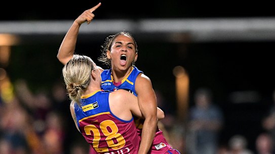 Courtney Hodder of the Lions celebrates after kicking a goal.
