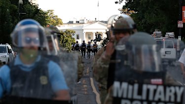 US police clear the area around Lafayette Park.
