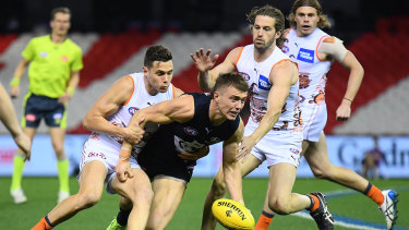 Patrick Cripps tackled by Josh Kelly.