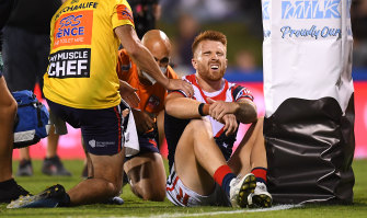 Adam Keighran is in pain after colliding with a post when scoring his third try of the night.