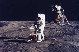 Buzz Aldrin conducts an experiment on the surface of the moon.