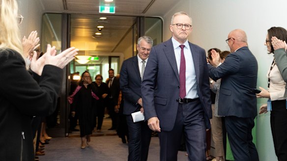 Albanese departs a Voice press conference, during which he repeatedly choked back tears.