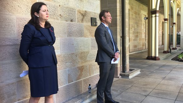 Premier Annastacia Palaszczuk and Health Minister Steven Miles watch as the Chief Health Officer explains her health advice about the Queensland-NSW border.