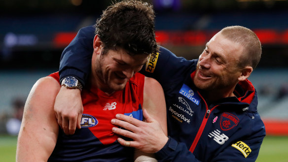 Angus Brayshaw, who has retired from football on medical advice, with coach Simon Goodwin.