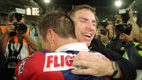 Michael Hagan and Andrew Johns celebrate grand final glory in 2001, Hagan’s first year as an NRL coach.