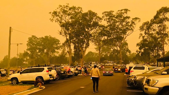 A yellow haze above the car park outside the evacuation centre.