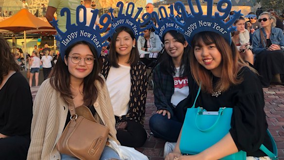 Japanese international students Hanae, Aoi, Yui and Madoka in Federation Square. 