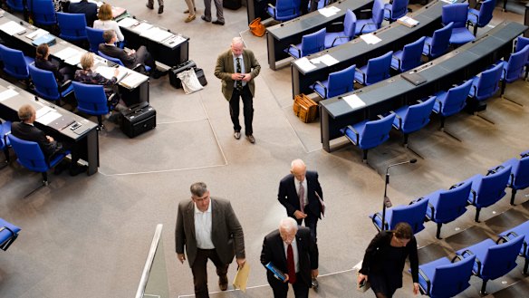 MPs of the Alternative for Germany and faction leader Alexander Gauland, centre, walk out.