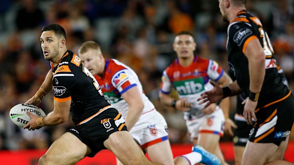 Airing the ball: Ryan Matterson sets the Tigers' back line in motion.