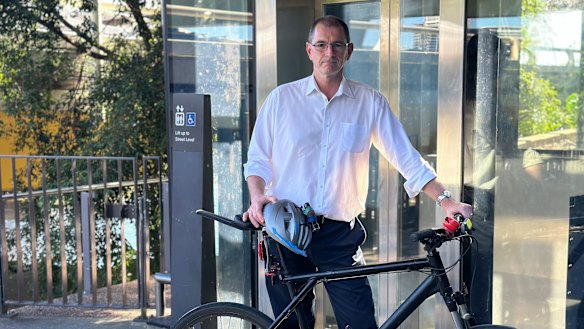 Paul French says he can carry his bike up the stairs, but the frequent outages inconvenience others.