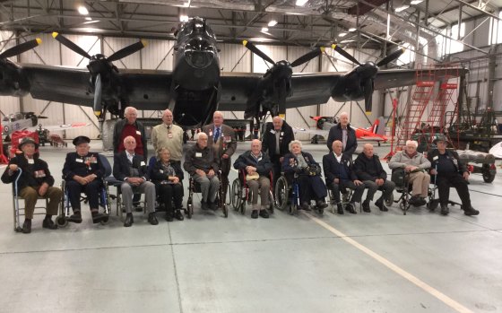 Veterans who flew to England last year with a Lancaster at the Battle of Britain Memorial Flight, RAF Scampton. Bob Wade is seated third from left.