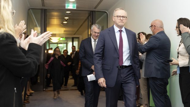 Albanese departs a Voice press conference, during which he repeatedly choked back tears.