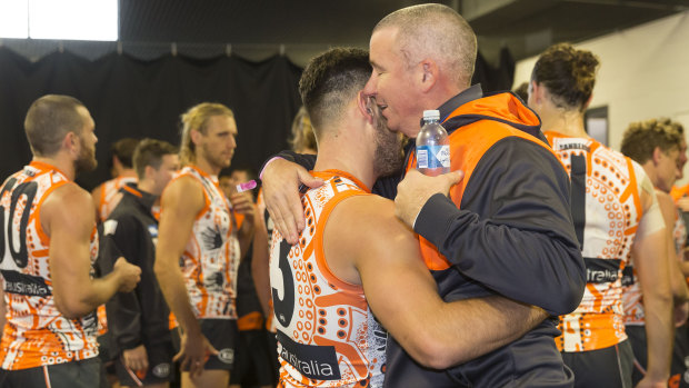 Morale booster: Stephen Coniglio with Gavin Robertson in the rooms after the Giants' victory.