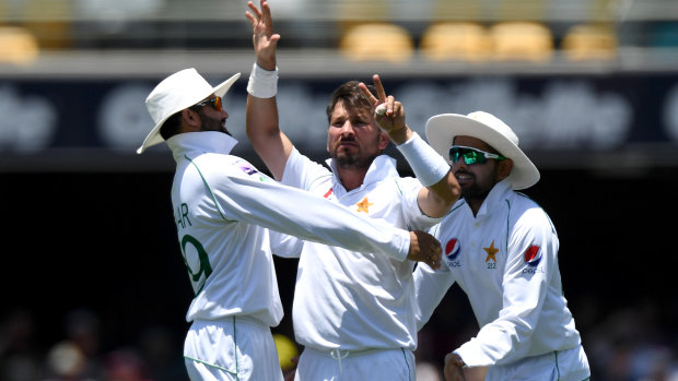 Seven and hell:  Yasir Shah gives Steve Smith a send-off afterdismissing him for the seventh time in Tests.