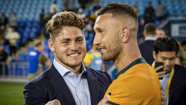 James O’Connor and Quade Cooper share a moment after the Wallabies beat the Springboks on the Gold Coast in September.