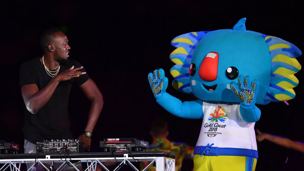 Usain Bolt performs on stage with Games mascot Borobi during the closing ceremony.
