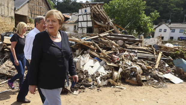 German Chancellor Angela Merkel, inspecting a flood-affected area.