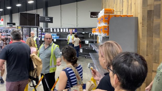 Shoppers queuing for toilet paper at Woolworths in Marrickville last Saturday. 