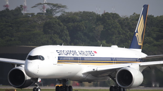 A Singapore Airlines Airbus A350-900 taxies on the runway at Changi Airport in Singapore.