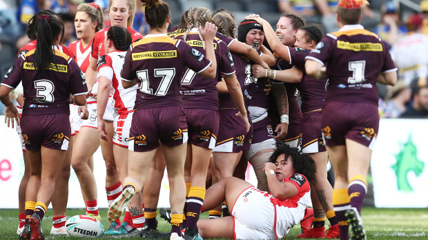 The Broncos celebrate Rona Peters four-pointer on Sunday at Bankwest Stadium.