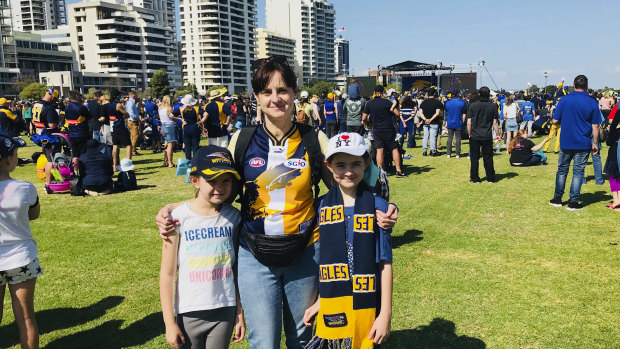 Vicki Carroll with daughters Violet, 10, and Amber, 7, at Langley Park ahead of West Coast's arrival in Perth.