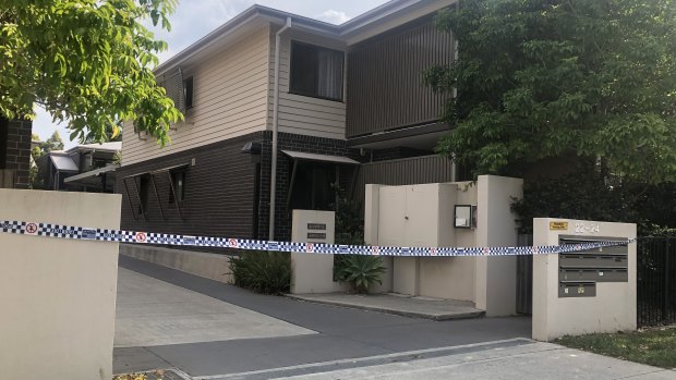 The crime scene at the Yeronga unit complex where Kym Mitchell’s body was found in a wheelie bin.