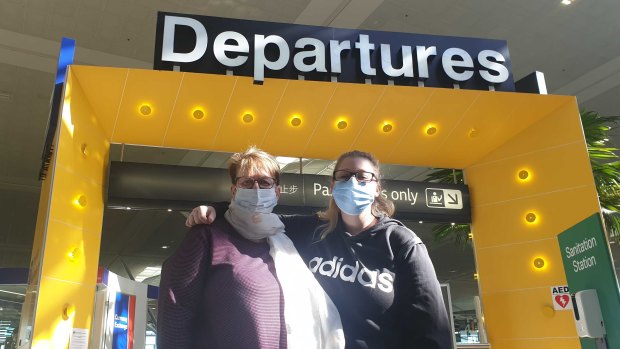 Jan Shatford and her daughter Ashleigh Shatford leave on the first flight out of the Brisbane Airport international terminal to New Zealand on Monday, April 19, 2021.