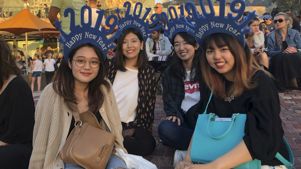 Japanese international students Hanae, Aoi, Yui and Madoka in Federation Square. 