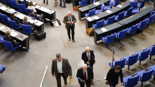 MPs of the Alternative for Germany and faction leader Alexander Gauland, centre, walk out.