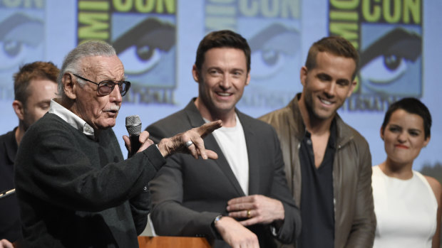 Stan Lee (left) with actors Hugh Jackman, who plays Wolverine, and Ryan Reynolds, who plays Deadpool, at Comic-Con.