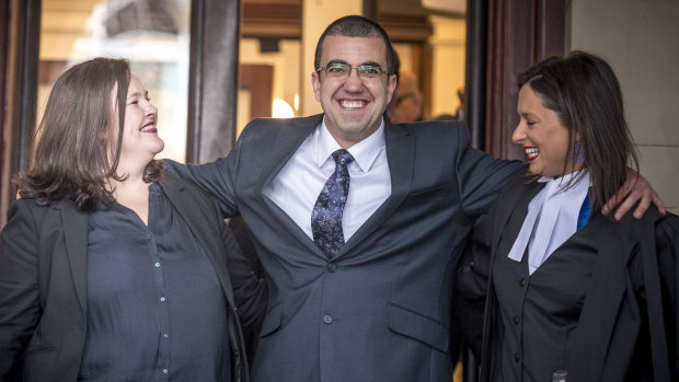 Faruk Orman, with his lawyers Ruth Parker, left, and Carly Lloyd, right, on the steps of the Supreme Court after his release from prison.